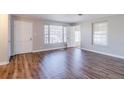 Bright living room with laminate flooring, neutral walls, and great natural lighting at 238 Howell Sw Dr, Atlanta, GA 30331