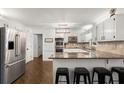 Modern kitchen with stainless steel appliances, granite countertops, and a breakfast bar at 275 Waverly W Trce, Roswell, GA 30075
