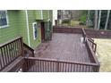 Expansive wooden deck with multiple levels and railings offers ample space for outdoor enjoyment and entertaining at 2102 Bedford Ct, Lithonia, GA 30058
