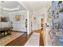 Elegant home interior showcasing hardwood floors, decorative moldings, and an open hallway layout at 230 Society St, Alpharetta, GA 30022