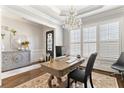 Stylish office space with hardwood floors, bright windows, and a sophisticated chandelier at 230 Society St, Alpharetta, GA 30022