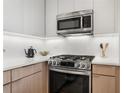 Bright kitchen features stainless steel appliances, stone countertops, and white subway tile backsplash at 384 Ralph Mcgill Ne Blvd # 314, Atlanta, GA 30312