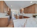 Spacious kitchen featuring custom cabinets, stainless steel appliances, and beautiful marble countertops at 2569 Woodhill Ln, Atlanta, GA 30344