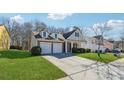 Inviting home with lush lawn and covered entrance flanked by manicured bushes, with ample driveway space at 6491 Stonelake Sw Pl, Atlanta, GA 30331