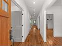 Bright hallway showcasing hardwood floors and modern doors, offering a glimpse into the home's layout at 891 Thurmond Nw St, Atlanta, GA 30314