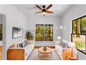 Cozy living room with stylish furnishings, a ceiling fan, and natural light streaming through the windows at 891 Thurmond Nw St, Atlanta, GA 30314