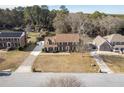 An aerial view showcases this beautiful home with a spacious yard in a quiet neighborhood at 4837 Mystere Cir, Lilburn, GA 30047