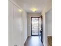Bright entryway features luxury vinyl plank flooring and a storm door that opens to a nice view outside at 6299 Valdez Dr, Rex, GA 30273