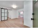 Inviting entryway with modern sliding door, beautiful hardwood floors, and a view into the bright, updated kitchen at , Atlanta, GA 30329