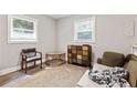 Bright living room with hardwood floors, a large window, and a quaint accent table at 2825 3Rd Sw Ave, Atlanta, GA 30315