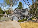 Inviting home with a well-kept lawn, driveway and classic architectural details providing a welcoming curb appeal at 166 Erie Ave, Decatur, GA 30030