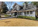 Beautiful two-story home featuring a well-maintained lawn and inviting entryway, reflecting timeless architectural style at 166 Erie Ave, Decatur, GA 30030