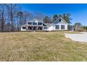 Charming two-story home featuring a welcoming front porch and spacious front yard at 684 Old Cumming Rd, Sugar Hill, GA 30518