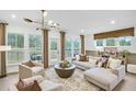 Sun-filled living room with stylish furnishings and a view of the outdoor space at 5773 Tillman Way, Powder Springs, GA 30127
