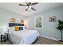 Cozy bedroom with fresh paint, neutral carpet, ceiling fan, and lots of natural light at 3261 Lowndes St, Atlanta, GA 30337