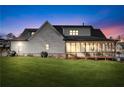 Expansive backyard featuring a covered patio, lush lawn, and privacy fencing at 39 Telfair Ct, Acworth, GA 30101