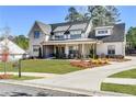 Charming home with a well-maintained lawn, elegant landscaping, and a long driveway at 39 Telfair Ct, Acworth, GA 30101