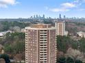 Aerial view of the building showcasing the skyline in the background and surrounding greenery at 1501 Clairmont Rd # 1027, Decatur, GA 30033