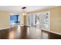 Open-concept living room with hardwood floors and recessed lighting at 3911 Ivy Ne Rd, Atlanta, GA 30342