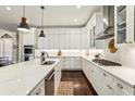 Modern kitchen with white cabinets, granite countertops, and stainless steel appliances at 12867 Etris Walk, Roswell, GA 30075