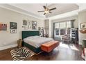 Stylish bedroom with tray ceilings, hardwood floors, and lots of natural light at 12867 Etris Walk, Roswell, GA 30075
