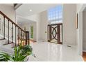 Spacious foyer with soaring ceilings, tiled floor, and an elegant front door with sidelights at 789 Rutland Ct, Lithonia, GA 30058