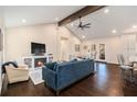 Cozy living room with a fireplace, vaulted ceilings, dark wood floors, and stylish furniture at 1888 Colt Dr, Atlanta, GA 30341