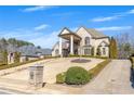 Beautiful home with a landscaped front yard, brick mailbox, and a driveway leading to the residence at 426 Lanesborough Dr, Marietta, GA 30064