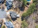 Aerial view of a home with a large backyard, mature trees and a swimming pool at 237 Elmbrook Ln, Canton, GA 30114