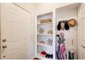 A tidy entryway with a white door, built-in shelving, and organized storage solutions at 3777 Peachtree Ne Rd # 722, Brookhaven, GA 30319