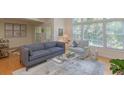 Bright living room features hardwood floors, neutral walls, and large windows at 3636 Habersham Rd # 2307, Atlanta, GA 30305