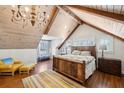 Charming bedroom with vaulted ceilings, wood accents, and a rustic bedframe at 1696 N Pelham Ne Rd, Atlanta, GA 30324