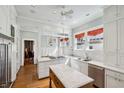 Bright kitchen with white cabinetry, stainless steel appliances, and marble countertops at 1696 N Pelham Ne Rd, Atlanta, GA 30324