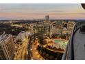 Aerial view of the rooftop pool with city views at dusk from the terrace at 3344 Peachtree Ne Rd # 3305, Atlanta, GA 30326