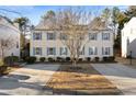 Well-maintained home featuring neutral siding, light blue shutters, and a driveway at 4403 Thorngate Ln, Acworth, GA 30101