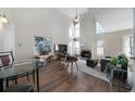 Bright living room with high ceilings, fireplace, large windows, and hardwood flooring at 4403 Thorngate Ln, Acworth, GA 30101