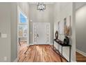 Bright entryway featuring hardwood floors, high ceilings, modern lighting, and stylish decor at 939 Whistler Ln, Canton, GA 30114