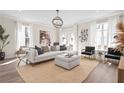 Bright and airy living room featuring a white sofa, modern decor, and lots of natural light at 1991 Hollywood Nw Rd # 14, Atlanta, GA 30318