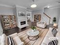 Bright living room with fireplace, modern decor, and stylish furnishings at 1235 Park Pass Way, Suwanee, GA 30024