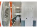 Bright foyer featuring a colorful door, light gray walls and stylish, modern gray-washed vinyl flooring at 2011 Two Springs Way, Lawrenceville, GA 30043