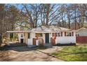 Single-story home with a carport, brick facade, and a well-maintained lawn at 248 N Lake Dr, Jonesboro, GA 30236