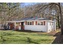 Charming single-story home with a lush, green lawn and cozy, inviting entryway at 248 N Lake Dr, Jonesboro, GA 30236