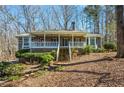 Charming single-story home with a welcoming front porch at 2704 Loring Nw Rd, Kennesaw, GA 30152