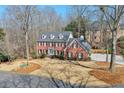 Elevated view of a brick home, showcasing its architectural design and surrounding landscape at 4679 Newell Dr, Marietta, GA 30062