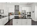 Kitchen featuring white cabinets, black countertops, and stainless steel appliances at 4206 Townsend Ln, Atlanta, GA 30346