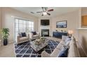 Comfortable living room with fireplace, plush seating, and stylish decor with sliding glass doors at 907 Redwood Dr, Norcross, GA 30093