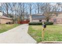 Home exterior with a well-kept lawn and a classic mailbox in front yard at 2589 Fieldstone View Se Ln # B, Conyers, GA 30013