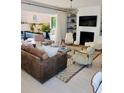 Stylish living room with a sleek fireplace, custom shelving, and a modern design aesthetic at 104 Grand Cres, Alpharetta, GA 30009