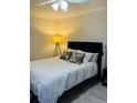 Simple bedroom with a full bed, geometric pillows, and overhead fan lighting at 25108 Plantation Dr # 108, Atlanta, GA 30324