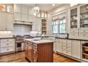 Well-appointed kitchen with stainless steel appliances, custom cabinets, and a marble-top island at 2805 N Hills Ne Dr, Atlanta, GA 30305